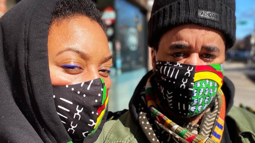 Woman and Man Wearing African Print Face Masks