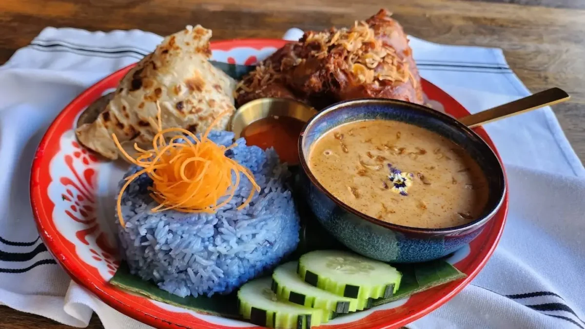 Thai curry with rice and cucumbers on side