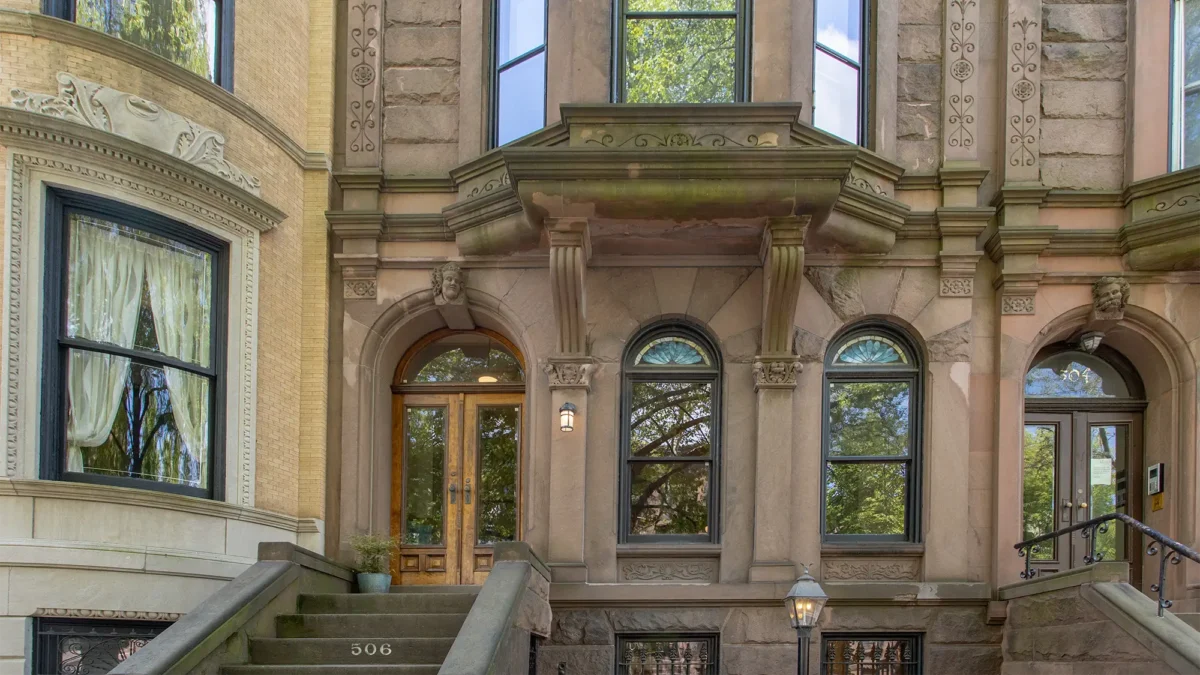 Romanesque Revival brownstone exterior with stoop steps