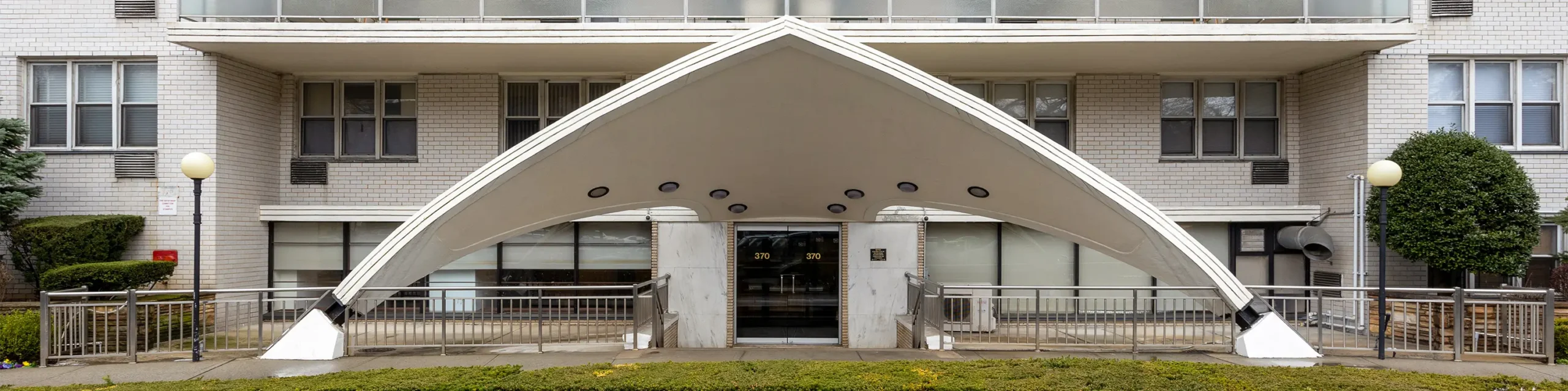 Exterior white A-frame Brooklyn apartment building