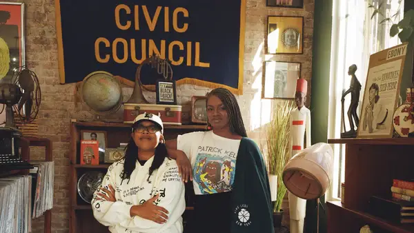 Two owners of BLK MKT Vintage in their store