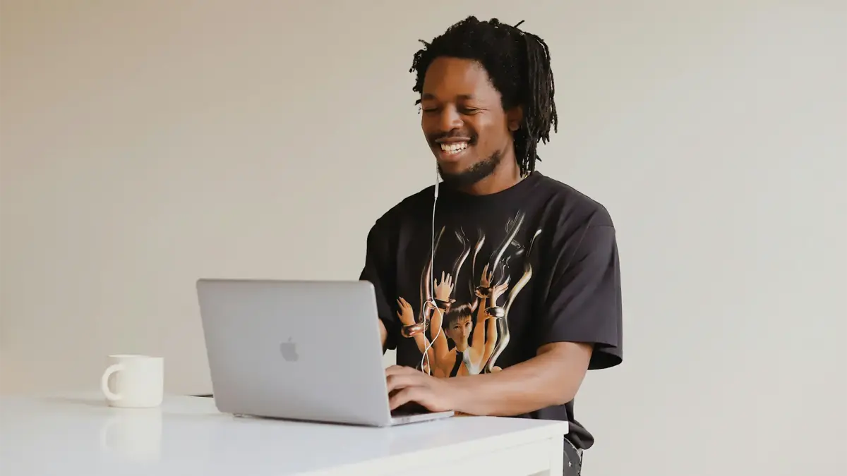 Man sitting at laptop computer