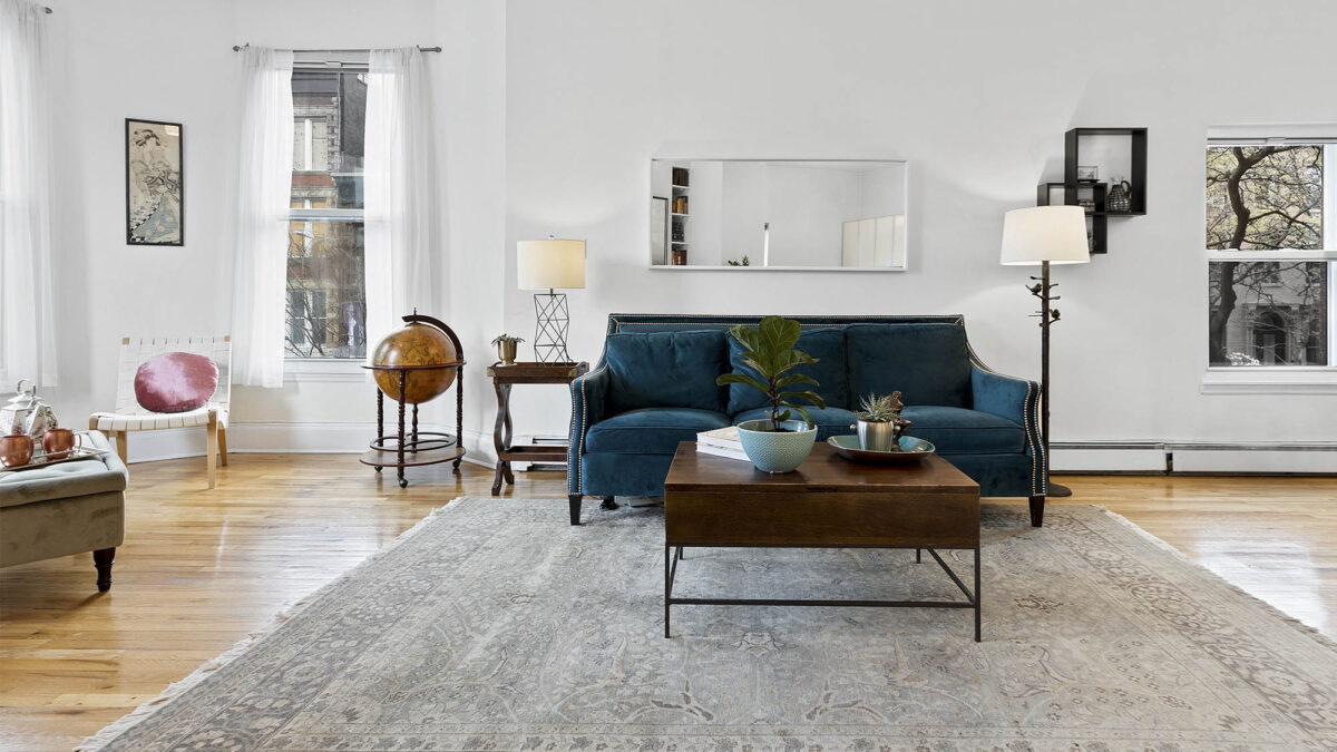 Staged living room with couch and coffee table
