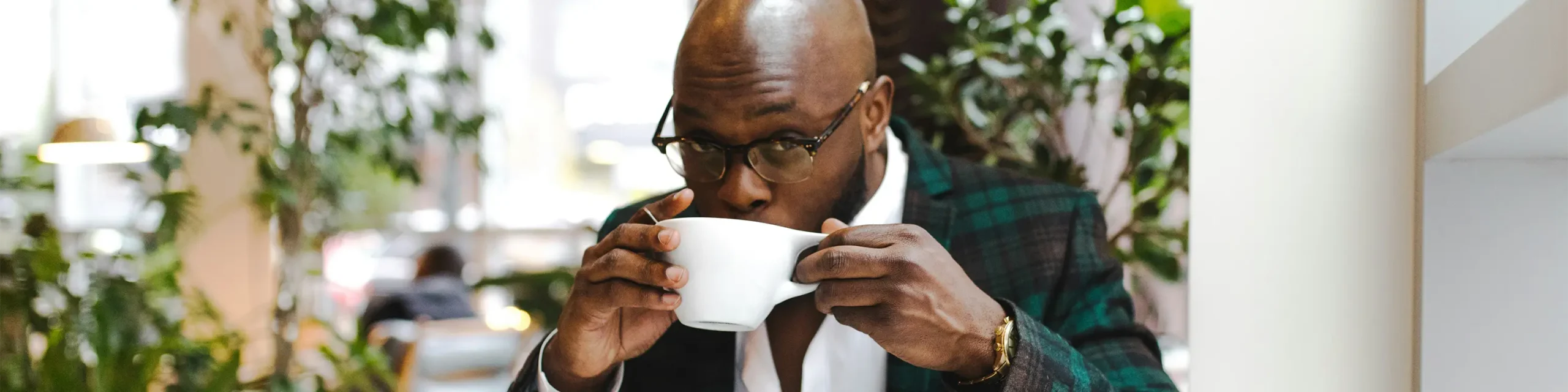 Black man sipping coffee