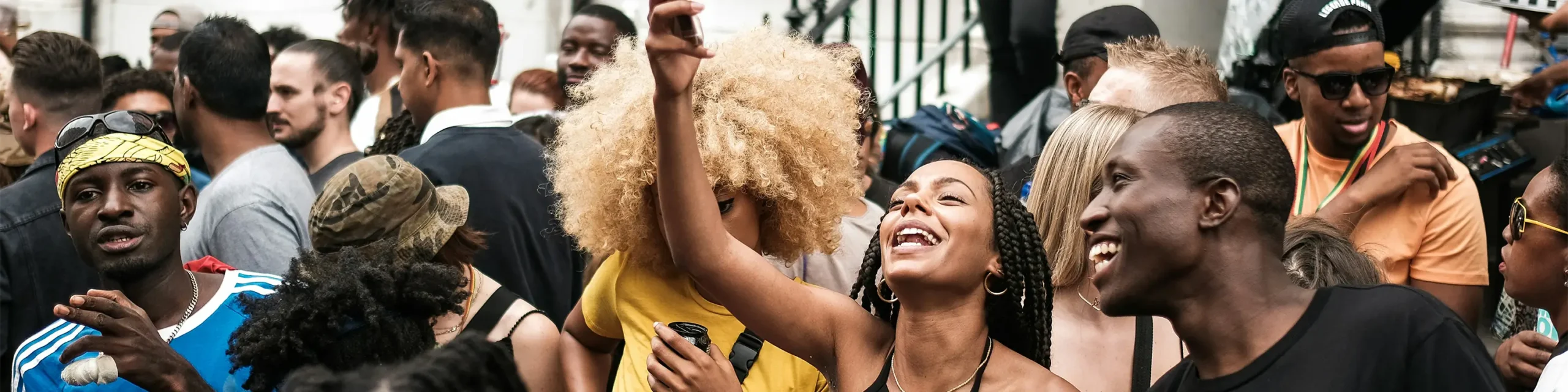 Black people celebrating in urban street